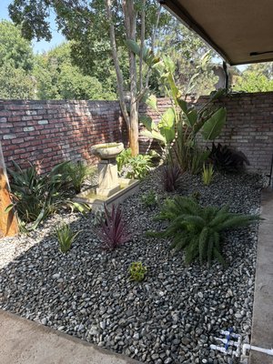 Garden remodel & sprinkler install - This was a remodel done for a client who was tired of staring at dirt and having his patio flood due to bad sprinkler system and unlevel ground. We changed all of that by leveling, dropping the ground level, removing and replacing the entire sprinkler system, then planting tropical style plants throughout the garden and finishing it off with a layer of river rock. Garden remodel & sprinkler install - This was a remodel done for a client who was tired of staring at dirt and having his patio flood due to bad sprinkler system and unlevel ground. We changed all of that by leveling, dropping the ground level, removing and replacing the entire sprinkler system, then planting tropical style plants throughout the garden and finishing it off with a layer of river rock.