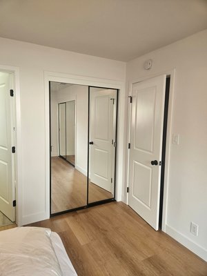 New black trim mirror closet doors - closet doors