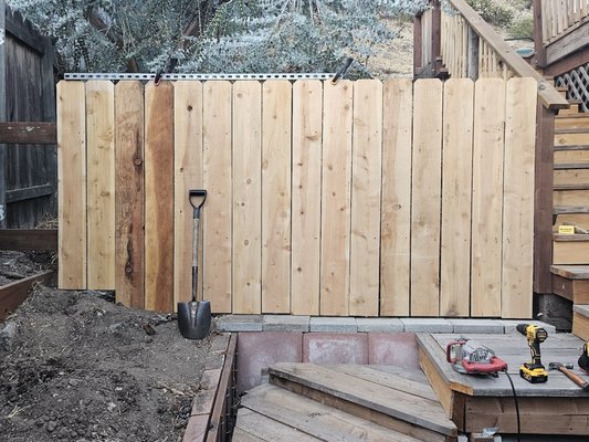 New fence - The home owner wanted a new fence to cover two sections of her yard that did not have any fencing. The client had deer fence up but wanted wood fence to match the other fencing in her yard. We removed the old deer fencing, dug the post holes, framed the fence and matched the planking to the rest of the fence. We also build a gate for access to the yard. We did two fencing sections, one on each side of the house. Client is happy. Dogs can no longer escape. New fence - The home owner wanted a new fence to cover two sections of her yard that did not have any fencing. The client had deer fence up but wanted wood fence to match the other fencing in her yard. We removed the old deer fencing, dug the post holes, framed the fence and matched the planking to the rest of the fence. We also build a gate for access to the yard. We did two fencing sections, one on each side of the house. Client is happy. Dogs can no longer escape.