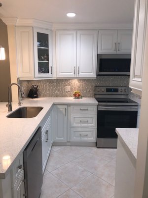 Boynton Beach Kitchen remodel - This was a small condo in Delray Beach. With closed walls to the hallway and living room. We designed a layout to open up the walls and expand the kitchen. We made a separate dining room and used the dining area of the kitchens to add cabinets and a built-in office desk & create. Boynton Beach Kitchen remodel - This was a small condo in Delray Beach. With closed walls to the hallway and living room. We designed a layout to open up the walls and expand the kitchen. We made a separate dining room and used the dining area of the kitchens to add cabinets and a built-in office desk & create.