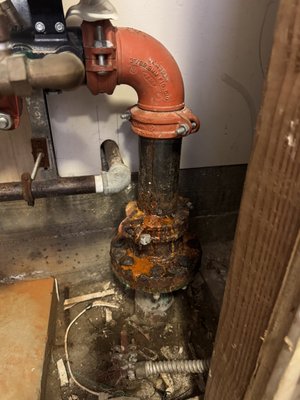 4" fire sprinkler repair - This repair was necessary due to electrolysis where copper meets steel. The original installation did not have a dielectric flange kit installed to separate the two metals. After contacting the water department to shut down the water in the street we were able to replace the setup with a dielectric flange kit and new material. New material beyond the dielectric flange included galvanized pipe for longevity and new victaulic fittings. The system was refilled and then a 5-year inspection was performed at a discounted rate for the customer. This property is now code compliant per NFPA codes and has no concern for water leaks or worse at the flange. 4" fire sprinkler repair - This repair was necessary due to electrolysis where copper meets steel. The original installation did not have a dielectric flange kit installed to separate the two metals. After contacting the water department to shut down the water in the street we were able to replace the setup with a dielectric flange kit and new material. New material beyond the dielectric flange included galvanized pipe for longevity and new victaulic fittings. The system was refilled and then a 5-year inspection was performed at a discounted rate for the customer. This property is now code compliant per NFPA codes and has no concern for water leaks or worse at the flange.