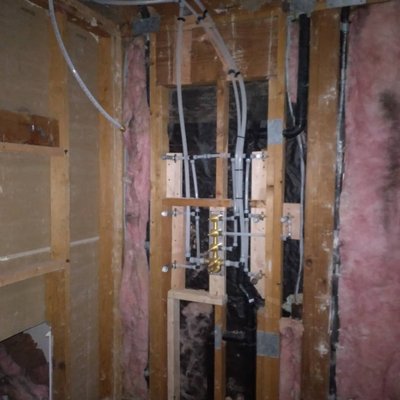 Bathroom Remodel - The Master Bathroom was reconfigured, the shower and the toilet needed to be moved. We cut concrete and laid down a new sewer and water lines. We piped in the new shower valve and drain.