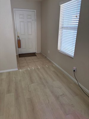 Multi Room Hybrid Laminate - This project was to remove carpeting and replace with a patented hybrid product that has the best properties of vinyl and laminate. It features a patented locking system, groundbreaking waterproof technology, and ultra protective layer. Combined with a 2mm closed-cell pad, it is a quiet and comfortable option. Many will mistake it for engineered hardwood. We offer the gamut of options from all the major manufacturers and will find what is right for the homeowner. We don't carry inventory that we want to clear out and push on our customers. Multi Room Hybrid Laminate - This project was to remove carpeting and replace with a patented hybrid product that has the best properties of vinyl and laminate. It features a patented locking system, groundbreaking waterproof technology, and ultra protective layer. Combined with a 2mm closed-cell pad, it is a quiet and comfortable option. Many will mistake it for engineered hardwood. We offer the gamut of options from all the major manufacturers and will find what is right for the homeowner. We don't carry inventory that we want to clear out and push on our customers.