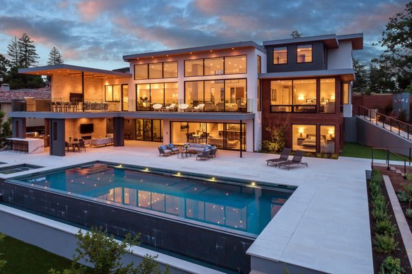 Award Winning A Modern Luxury Estate - A luxury estate designed to enjoy the outdoors, as much as the indoors. This fine line is blended together with the use of the wall to wall glass to enjoy the backyard views.
The backyard is built-in steps to respect the hills it sits on.
The backyard is the epitome of outdoor living & entertaining. A lap pool, jacuzzi, outdoor kitchen accompanied by a basketball court for those sports lovers Award Winning A Modern Luxury Estate - A luxury estate designed to enjoy the outdoors, as much as the indoors. This fine line is blended together with the use of the wall to wall glass to enjoy the backyard views.
The backyard is built-in steps to respect the hills it sits on.
The backyard is the epitome of outdoor living & entertaining. A lap pool, jacuzzi, outdoor kitchen accompanied by a basketball court for those sports lovers