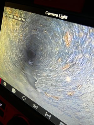 Camera inspection - Customer was dealing with frequent backups so she requested a camera along with clearing out the drain found out that it was a crack in the bottom of the pipe about 4 to 5 feet in length the only way to service this is to cut the pipe out completely and replace it with new material.