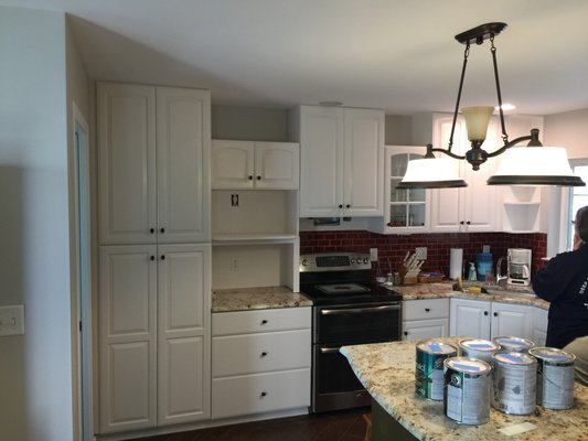 Transform that kitchen into something you've wanted for a fraction of the cost of new cabinetry. - CertaPro Painters take pride in everything they are painting. We are happy to provide a production update regarding our cabinet painting. We have just recently re-built our entire cabinet area. The building of 2 rooms. A dry room that is fully capable of holding up to 80 cabinet doors and drawers at a time using our new dry rack system. In the other room is a vent fan and a 12'x12' paint booth. Both rooms are climate controlled, so we can complete these projects year around. All surfaces will be cleaned, lightly sanded, cracks caulked on doors, drawers, or framework. All doors and drawer faces are taken back to our spray booth at the office. Framework will be brush and roll using only high-quality mini rollers and brushes. Once all painting is completed your crew will reassemble cabinets, hinges, knob and new clear bumpers. We wo all of this while covering and protecting your floors, furniture, countertop, etc. Once our crews are finished, they would invite to you complete a pride walk (inspection). We will happily take care of any touch ups if needed. Leaving you with your brand-new Kitchen you've some long deserved. Providing you touch up paint and last but not least a 2-year warranty. Give us a call we would love to provide you a free in home or remote estimate!
