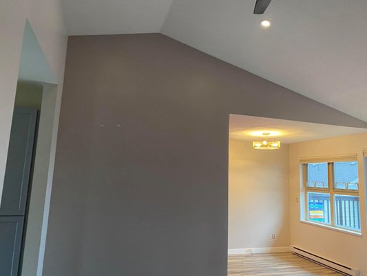 Painting a wall for a client in Vancouver, BC - The client wanted to change the colour of the walls in one part of the house. They were also painting their interiors but needed some extra hands especially in the hard-to-reach places.