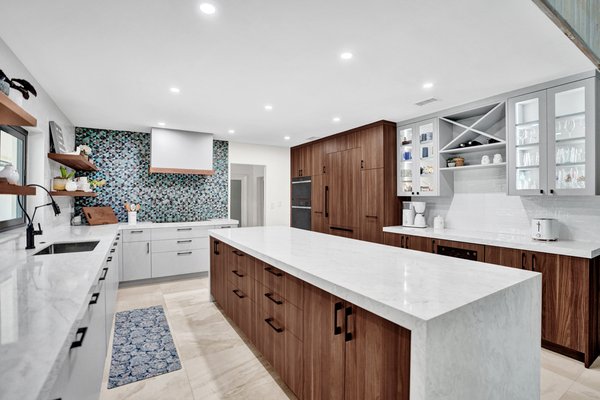 Artistically Accented Modern Kitchen Remodel - A modern kitchen with a splash of creative color is the perfect way to customize your space and design. The modern style of the cabinetry and countertops blend perfectly when combined with an artistic backsplash, featured here with turquoise and gray slate tiling. Artistically Accented Modern Kitchen Remodel - A modern kitchen with a splash of creative color is the perfect way to customize your space and design. The modern style of the cabinetry and countertops blend perfectly when combined with an artistic backsplash, featured here with turquoise and gray slate tiling.