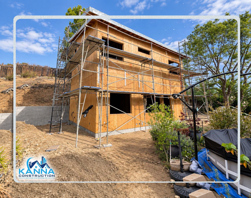 Santee | A New Home Rises - Structural progress on a spacious, two-story multi-family duplex. This phase highlights full multi-level scaffolding, engineered wood framing, window cutouts, and foundation grading with concrete block retaining walls to stabilize the hillside terrain. Santee | A New Home Rises - Structural progress on a spacious, two-story multi-family duplex. This phase highlights full multi-level scaffolding, engineered wood framing, window cutouts, and foundation grading with concrete block retaining walls to stabilize the hillside terrain.