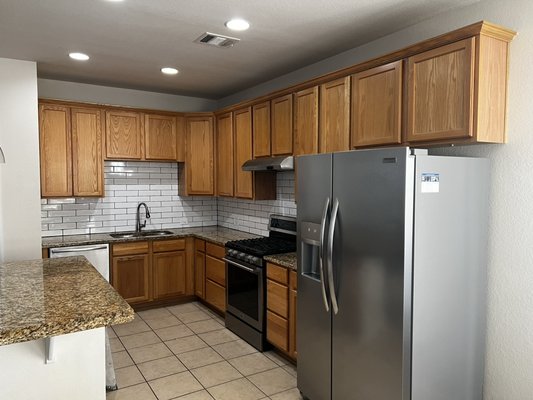 Kitchen Cabinets Painting - This Renovation was done on a kitchen that was in bad shape . The rest of the house had been updated. We gave it a new fresh coat of paint install door handles and the result was absolutely stunning.  The owner absolutely loves cooking there now!
