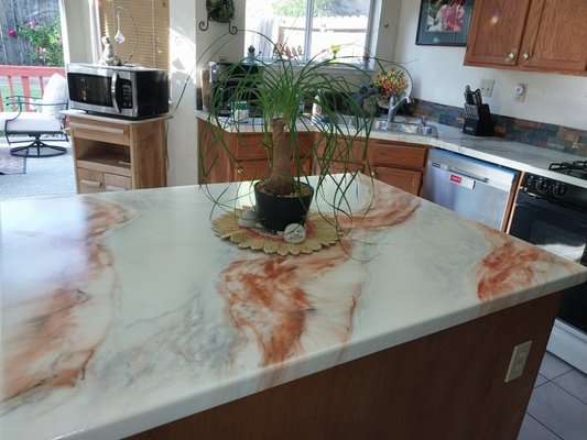 Kitchen countertop upgrade - This kitchen was updated from tile countertops to custom epoxy countertops. The countertops were create by an artist that created the look of artificial stone. Any design or photograph can become part of your countertop. The epoxy finish is extremely durable like other man made epoxy countertops. Kitchen countertop upgrade - This kitchen was updated from tile countertops to custom epoxy countertops. The countertops were create by an artist that created the look of artificial stone. Any design or photograph can become part of your countertop. The epoxy finish is extremely durable like other man made epoxy countertops.