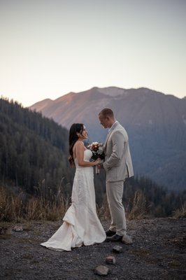 Mountain Elopement - High above the tree line, with golden light spilling across the ridges of Tiger Mountain, they said their vows—just the two of them, a breeze, and the quiet hum of nature. The bride’s dress caught the last rays of sun like silk on fire, and the groom’s eyes never left hers. No crowd, no chaos—just raw emotion and the kind of intimacy that only the mountains can hold.
As their photographer, I focused on the quiet glances, the laughter echoing off the cliffs, and the way the light danced between them. Every frame told a story of freedom, love, and the beauty of choosing simplicity. From candid moments on the trail to golden hour portraits at the summit, this elopement was a reminder that sometimes the most powerful stories are the ones whispered between two hearts. Mountain Elopement - High above the tree line, with golden light spilling across the ridges of Tiger Mountain, they said their vows—just the two of them, a breeze, and the quiet hum of nature. The bride’s dress caught the last rays of sun like silk on fire, and the groom’s eyes never left hers. No crowd, no chaos—just raw emotion and the kind of intimacy that only the mountains can hold.
As their photographer, I focused on the quiet glances, the laughter echoing off the cliffs, and the way the light danced between them. Every frame told a story of freedom, love, and the beauty of choosing simplicity. From candid moments on the trail to golden hour portraits at the summit, this elopement was a reminder that sometimes the most powerful stories are the ones whispered between two hearts.
