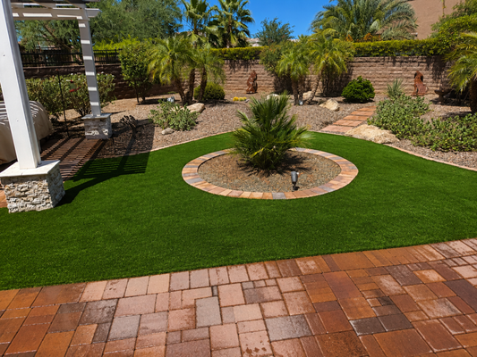 A Backyard Made to Unwind - This backyard combines lush artificial turf with beautifully installed pavers to create a space that feels calm, inviting, and effortlessly polished. The thoughtful layout brings warmth and balance to the design, turning the yard into the perfect place to relax and enjoy the outdoors. A Backyard Made to Unwind - This backyard combines lush artificial turf with beautifully installed pavers to create a space that feels calm, inviting, and effortlessly polished. The thoughtful layout brings warmth and balance to the design, turning the yard into the perfect place to relax and enjoy the outdoors.