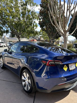 Exterior Detail - This Tesla Model Y received our exterior detail with a add on of wax! Waxing your car adds a protective layer over the paint, enhancing its shine and helping to repel dirt, water, and UV rays. It reduces the risk of fading, oxidation, and minor scratches, while making the surface smoother and easier to clean. Regular waxing keeps your car looking glossy and well-maintained for longer.