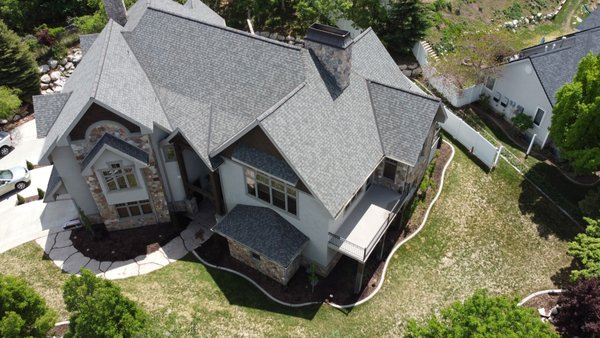 Landmark Pro Shingle Install on this East bench home - The 2 story extreme pitch roof on this home made removing the old roof and installing this new Certainteed Landmark Pro shingle roof a challenge, but our crews were up for it. From roof removal to install to clean-up - it was an awesome project. Landmark Pro Shingle Install on this East bench home - The 2 story extreme pitch roof on this home made removing the old roof and installing this new Certainteed Landmark Pro shingle roof a challenge, but our crews were up for it. From roof removal to install to clean-up - it was an awesome project.