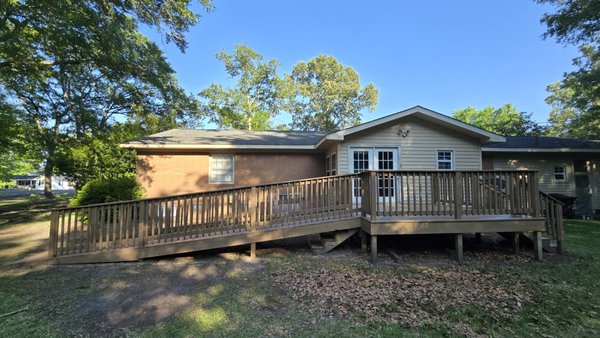 Deck Rebuild - This project involved a complete rebuild of a previously repaired deck and wheelchair ramp that had significant workmanship and structural issues. Strictly Renovations fully removed the existing ramp and deteriorated deck components, rebuilt the framing and decking to proper specifications, and installed new railings and access ramp for long-term durability and safety. The finished project was sealed with a solid tan stain chosen by the homeowner for a clean, refreshed appearance. Deck Rebuild - This project involved a complete rebuild of a previously repaired deck and wheelchair ramp that had significant workmanship and structural issues. Strictly Renovations fully removed the existing ramp and deteriorated deck components, rebuilt the framing and decking to proper specifications, and installed new railings and access ramp for long-term durability and safety. The finished project was sealed with a solid tan stain chosen by the homeowner for a clean, refreshed appearance.