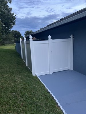 6' High White Privacy Screen - Our client wanted to hide their trash cans from being seen from the street. We used the space they had to make a place outside for storage. We installed white panels that are 6 feet tall, a gate that is 4 feet wide, and all the parts of the gate were white too! 6' High White Privacy Screen - Our client wanted to hide their trash cans from being seen from the street. We used the space they had to make a place outside for storage. We installed white panels that are 6 feet tall, a gate that is 4 feet wide, and all the parts of the gate were white too!