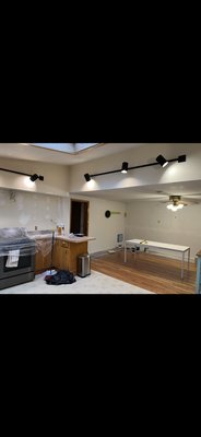 Dinning Room and Kitchen - Started off by patching some drywall on the walls and ceiling. Then put a primer coat on everything ceiling and walls painted the kitchen white and then the dining room a two-tone green using Sherwin-Williams brand paint