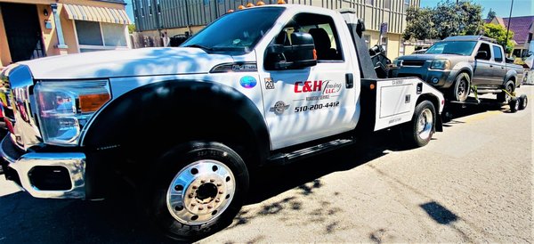 C&H Towing LLC - This vehicle is a 4x4 that was raised with dollies so all four wheels wouldn't contact the road.