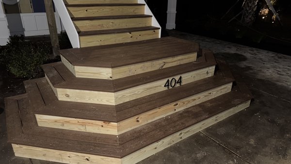 Custom 22.5 degree landing with composite decking! - Our professional services were called in to box frame these stairs at a 22.5 angle, install riser boards, and finish out with composite decking! We were subcontracted for this project out in the holly ridge area. Custom 22.5 degree landing with composite decking! - Our professional services were called in to box frame these stairs at a 22.5 angle, install riser boards, and finish out with composite decking! We were subcontracted for this project out in the holly ridge area.