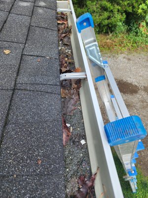 Before and After Gutter Cleaning - This is a basic before and after of a gutter that had standing water from the rain.