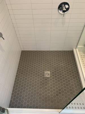 Shower Regrout - This shower had grout that was failing on the walls and the pan, as well as caulking that was molding. We were able to extract the old grout from the walls and replace it with new epoxy grout as well as skim coating the pan with fresh new epoxy grout. We also removed the old caulking and replaced it with new caulking. Epoxy grout is commercial grade and is used in malls, movie theaters, restaurants, etc. Extremely strong and long lasting. Shower Regrout - This shower had grout that was failing on the walls and the pan, as well as caulking that was molding. We were able to extract the old grout from the walls and replace it with new epoxy grout as well as skim coating the pan with fresh new epoxy grout. We also removed the old caulking and replaced it with new caulking. Epoxy grout is commercial grade and is used in malls, movie theaters, restaurants, etc. Extremely strong and long lasting.