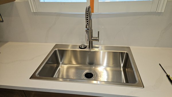 Kitchen Sink, Faucet, Garbage Disposal Installs - This newly remodeled rental home was just missing the finishing touches of a new sink, faucet, and garbage disposal. All material was provided by the customer. Kitchen Sink, Faucet, Garbage Disposal Installs - This newly remodeled rental home was just missing the finishing touches of a new sink, faucet, and garbage disposal. All material was provided by the customer.