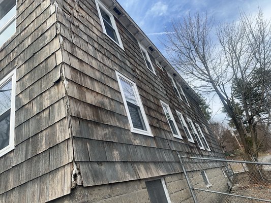From Shaker to Vinyl - The old shaker siding was fading, molding, coming off; Replaced with gray vinyl siding and new white trim accents. From Shaker to Vinyl - The old shaker siding was fading, molding, coming off; Replaced with gray vinyl siding and new white trim accents.