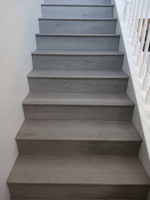 Stair Remodel - This was part of an installation that included a flight of stairs. The old carpet was torn away and the new floor was installed.