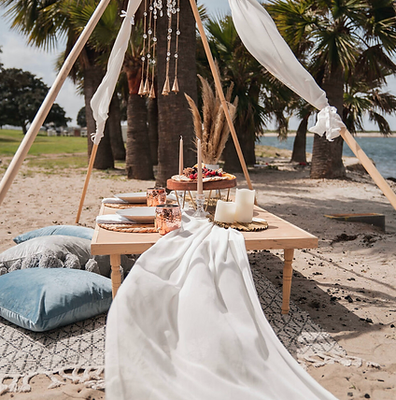 Luxury Picnic Packages - Occasions big and small all deserve festive attention. We offer the ideal backdrop for your celebration: no work, no cleanup, and a great view!  No matter what you're celebrating we want to be part of the action.

Basic Package for Two:
Includes: 
 - Lemon Infused Water for Two
- Antique White Umbrella
-Low to Ground Wood Table
-Table Decor
-Lantern/Candles
-Fresh Flowers
-An assortment of Throw Pillows & Cushions 
-Rugs / Blankets
-Glasses, Utensils & Plates
-A Shoe & Bag Storage Area
-Basket Filled with Hand Sanitizer, Antibacterial Wipes, Bug Spray, and Extra Napkins
*No Food Included
(you may bring your own or purchase food options available)
Time: 2 Hour Experience | $325


Deluxe Luxury Package For Two:
This package includes a luxurious bohemian picnic set up for two with a charcuterie board. Set up and clean up included! Add-ons are available.

Includes:
- Medium Delicious Grazing Box for Two
(assorted cheese, variety of cured meat, seasonal fruits, crackers, honey, assorted nuts & sweets)
Vegetarian Option Available
-Fresh Floral Arrangement to Take Home
- Bell Tent with Styling
-Low to Ground Wood Table
-Table Decor
-Lanterns / Candles
-An Assortment of Throw Pillows & Cushions 
-Rugs / Blankets
-Glasses, Utensils & Plates
-A Shoe & Bag Storage Area
- Bluetooth Speaker
- Your Custom Message on a Free Standing Chalkboard Easel
-Basket Filled with Hand Sanitizer, Antibacterial Wipes, Bug Spray, and Extra Napkins 
Time: 2 Hour Experience | $450

Ultimate Picnic Package for Two:
This package includes bohemian decor, a personal message board, an ice chest, blankets, a shoe and bag storage area,  and a care station. This setup is for two with a large charcuterie board and your choice of refreshments. Set up and clean up included! Add-ons are available
Includes: 
- Large Delicious Grazing Box for Two
(assorted cheese, variety of cured meat, seasonal fruits, crackers, honey, assorted nuts & sweets)
Vegetarian Option Available
- Dessert Grazing for Two
-Fresh Flower Arrangement to Take Home
- Beverage Station  (includes fruit-infused water & tea or lemonade)
-Low to Ground Wood Table
-Table Decor
-Lanterns / Candles
-An Assortment of Throw Pillows & Cushions 
-Rugs / Blankets
-Glasses, Utensils & Plates
-A Shoe & Bag Storage Area
- Your Custom Message on a Free Standing Chalkboard Easel 
- Bell Tent with Styling 
-Basket Filled with Hand Sanitizer, Antibacterial Wipes, Bug Spray, and Extra Napkins
Time : 2 Hour Experience| $650

Everything But Sand & Water Package
The Ultimate Beach Picnic
The Ultimate Beach Day package includes: Set up & clean up, premium beach cabana, game section, 2 paddle boards and floatiest, an array of pillows, rugs for seating, sandwich box & sparkling beverage for every picnicker, umbrella & lighting, dried and fresh florals, personalized message board, bluetooth speaker, and use of everything for 4 hours up to 4 people.

4 hours - $699
St. Pete Beach, FL.
