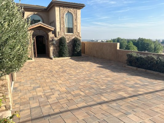 Paver Driveway - In the picturesque hills of Signal Hill, California, a transformation unfolded as Vision Turf and Pavers set out to replace an old and worn concrete driveway with an opulent paver counterpart. This wasn't just a renovation; it was an endeavor to elevate the beauty and value of a cherished home.

The journey began with the removal of the tired concrete, paving the way for a new chapter in the residence's aesthetic narrative. The homeowner envisioned a driveway that not only exuded elegance but also stood as a testament to meticulous craftsmanship. With this vision in mind, we embarked on crafting a high-end paver driveway that would redefine the property.

Every paver was chosen with precision, each a testament to durability, style, and timeless allure. The interlocking pieces created a mosaic of sophistication, transforming what was once mundane into a visual symphony that harmonized with the surrounding landscape.

As the driveway took shape, it became clear that this wasn't merely an upgrade; it was an investment in the home's allure and value. The rich hues and textures of the pavers added depth to the entrance, enhancing curb appeal and providing a warm welcome to both residents and guests.

The beauty of this project extended beyond aesthetics. Pavers, renowned for their durability, promised longevity, and ease of maintenance, ensuring the driveway would withstand the test of time while requiring minimal upkeep.

The completion of the high-end paver driveway not only fulfilled the homeowner's vision but also elevated the entire neighborhood's streetscape. The residence, now adorned with a driveway that reflected opulence and sophistication, stood as a beacon in Signal Hill—a testament to the transformative power of thoughtful design and quality craftsmanship.

This project wasn't merely about replacing concrete with pavers; it was about redefining the very essence of the home. The culmination of meticulous planning and skilled execution resulted in a driveway that didn't just serve its functional purpose but became a statement piece, enhancing both the beauty and intrinsic value of the cherished residence in Signal Hill, California.