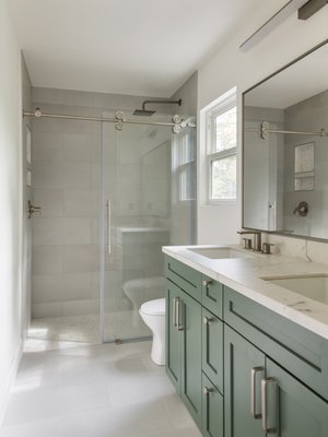 Bathroom Remodel - This dated bathroom was completely reimagined into a bright, modern retreat. We replaced the old tub with a spacious walk-in shower, added a soft sage-green vanity with marble counters, and introduced warm neutral finishes throughout. The result is a clean, timeless space that feels fresh, functional, and elevated—perfectly blending comfort and style. Bathroom Remodel - This dated bathroom was completely reimagined into a bright, modern retreat. We replaced the old tub with a spacious walk-in shower, added a soft sage-green vanity with marble counters, and introduced warm neutral finishes throughout. The result is a clean, timeless space that feels fresh, functional, and elevated—perfectly blending comfort and style.