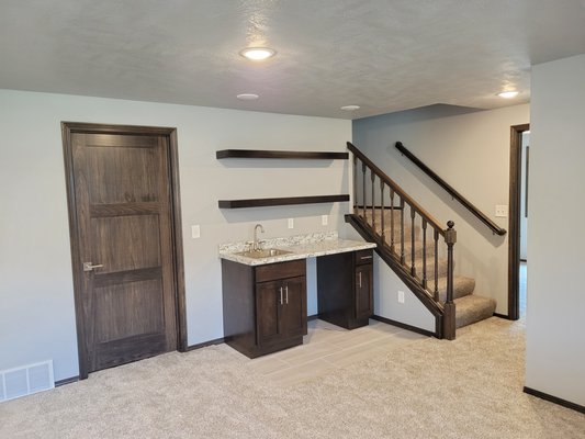 Basement Finish - From unfinished to the perfect place to spend time as a family.  Adding a bathroom, 2 bedrooms, a wet bar and large family room.