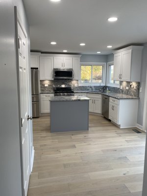 First floor & Kitchen remodel - Entire first floor remodel. All new flooring throughout entire first floor. Brand new kitchen cabinets and island, all new appliances installed, wet bar added, hall bath completed with flooring carried in.