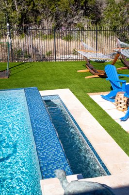 Pools with Artificial Turf - Have a pool and are considering installing artificial turf? Smart move! With artificial turf, you can say "goodbye" to rinsing off wet, muddy feet and skimming grass clippings out of your pool! Your pool isn't looking its best surrounded by dead, brown grass, either. Artificial turf will make your pool look luxe, whether it's in or above ground! Contact us for a FREE estimate! Pools with Artificial Turf - Have a pool and are considering installing artificial turf? Smart move! With artificial turf, you can say "goodbye" to rinsing off wet, muddy feet and skimming grass clippings out of your pool! Your pool isn't looking its best surrounded by dead, brown grass, either. Artificial turf will make your pool look luxe, whether it's in or above ground! Contact us for a FREE estimate!