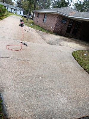 pressure washing driveway - Here we have a customer getting the driveway cleaned before having his home looked at prior to selling. Another happy customer!