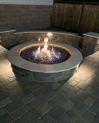Fire pits and fire features - We design and install fire pits and fire features sure to make your backyard oasis the envy of the neighborhood. Fire pits are a great addition to a back yard and provide you and your friends and family with hours of entertainment. Our fire pits are made with quality materials that are sure to last for years to come. And best of all, they come in a variety of sizes and styles to suit your unique taste. So whether you’re looking for a sleek and modern design or something more rustic, we’ve got you covered. Fire pits and fire features - We design and install fire pits and fire features sure to make your backyard oasis the envy of the neighborhood. Fire pits are a great addition to a back yard and provide you and your friends and family with hours of entertainment. Our fire pits are made with quality materials that are sure to last for years to come. And best of all, they come in a variety of sizes and styles to suit your unique taste. So whether you’re looking for a sleek and modern design or something more rustic, we’ve got you covered.