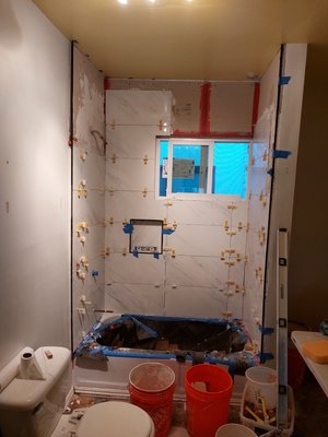 Bathroom with the crooked wall - Complex object. The curvature of a 3-fit wall is 1 inch. The customer did not want to spend money on leveling the wall, in this case me had to lay out the tiles on the plane, observing the geometry. Before work began, the old tiles had to be removed. The tile was removed along with the drywall. In some places I was able to see the street after removal.) Offered the customer to change the window. Installed a new one for only $50. Forgot to take the final photo. But the customer was satisfied with the work. Heavy Bathroom with the crooked wall - Complex object. The curvature of a 3-fit wall is 1 inch. The customer did not want to spend money on leveling the wall, in this case me had to lay out the tiles on the plane, observing the geometry. Before work began, the old tiles had to be removed. The tile was removed along with the drywall. In some places I was able to see the street after removal.) Offered the customer to change the window. Installed a new one for only $50. Forgot to take the final photo. But the customer was satisfied with the work. Heavy