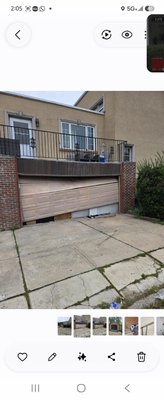 Replacing the old, broken garage door with a new one. - We swapped out the old garage door for a new, modern one. It makes your garage look better and work smoother.