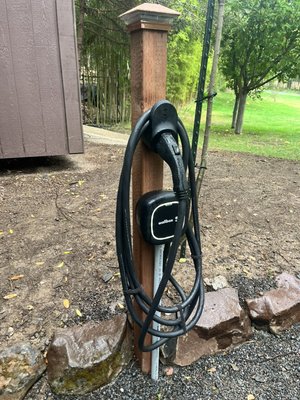 EV or Electric Vehicle Charging station at exterior residential parking spot. - This customer was fantastic to work with. They needed a charging station near their exterior parking spot. It all worked out beautifully.