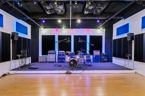 Live Room A - Live Room A is a versatile 625 square foot tracking room with a balance of absorption, diffusion and reflective surfaces. Its ambiance makes it ideal for recording drums, full bands, vocal ensembles and other instrumental ensembles. When not being used to record music it serves as an ideal space for live stream performances, and as a photo and video production stage. Live Room A - Live Room A is a versatile 625 square foot tracking room with a balance of absorption, diffusion and reflective surfaces. Its ambiance makes it ideal for recording drums, full bands, vocal ensembles and other instrumental ensembles. When not being used to record music it serves as an ideal space for live stream performances, and as a photo and video production stage.