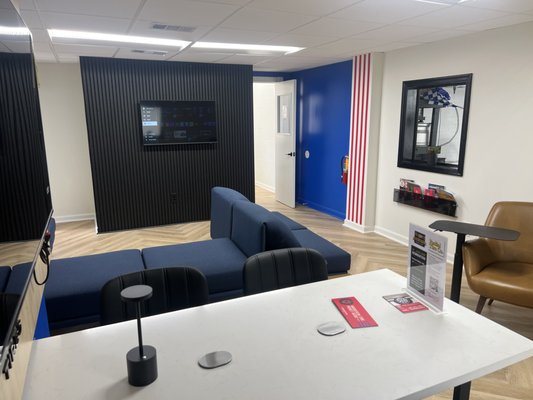 Stay Productive While We Service Your Vehicle - Experience the Vredestein Business Lounge, a premium workspace designed to keep you productive while your vehicle is being serviced. Enjoy complimentary high-speed Wi-Fi, convenient device charging stations, adjustable-height work tables with integrated lighting, dedicated monitors, and a spacious conference table for meetings or collaboration. Overlooking our service bays, the lounge provides a unique bird's-eye view of your vehicle's care, giving you complete visibility while you work, connect, or relax. At Radial Tire Co., service time doesn't have to mean downtime. Stay Productive While We Service Your Vehicle - Experience the Vredestein Business Lounge, a premium workspace designed to keep you productive while your vehicle is being serviced. Enjoy complimentary high-speed Wi-Fi, convenient device charging stations, adjustable-height work tables with integrated lighting, dedicated monitors, and a spacious conference table for meetings or collaboration. Overlooking our service bays, the lounge provides a unique bird's-eye view of your vehicle's care, giving you complete visibility while you work, connect, or relax. At Radial Tire Co., service time doesn't have to mean downtime.