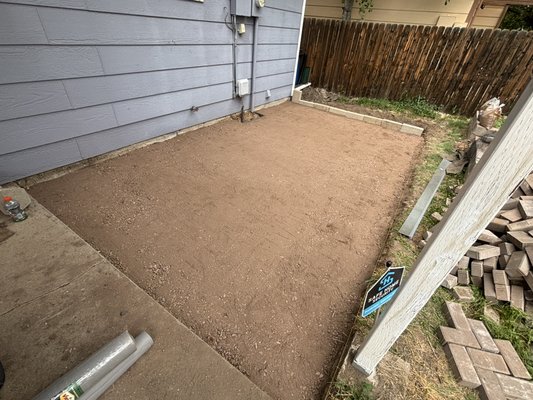Paver Patio - After excavating almost 6 tons of dirt from the area, we built out a frame to level the ground to a perfect level to match the pitch of the existing concrete patio. From there, we added road base and paver sand to the correct height, and then started laying our bricks. We used a brake saw for all of the corners and angle cuts. Paver Patio - After excavating almost 6 tons of dirt from the area, we built out a frame to level the ground to a perfect level to match the pitch of the existing concrete patio. From there, we added road base and paver sand to the correct height, and then started laying our bricks. We used a brake saw for all of the corners and angle cuts.