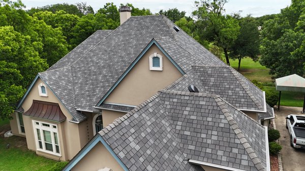 Vision Roofing x IKO Royal Estate Mountain Slate - From standard to standout. 🏰 We recently upgraded this home with IKO Royal Estate in Mountain Slate. These designer shingles are precision-cut to mimic the random, hand-hewn look of natural slate tiles. The Mountain Slate color blend offers a timeless, majestic look that perfectly complements stone and masonry work. It’s the ultimate ‘crown’ for a distinguished home! Vision Roofing x IKO Royal Estate Mountain Slate - From standard to standout. 🏰 We recently upgraded this home with IKO Royal Estate in Mountain Slate. These designer shingles are precision-cut to mimic the random, hand-hewn look of natural slate tiles. The Mountain Slate color blend offers a timeless, majestic look that perfectly complements stone and masonry work. It’s the ultimate ‘crown’ for a distinguished home!