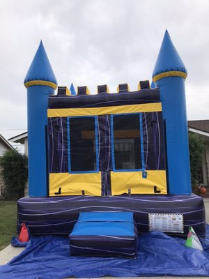 Jumper Rentals - 13 x 13 Marble Jumper Bounce House set up in a driveway. Jumper Rentals - 13 x 13 Marble Jumper Bounce House set up in a driveway.