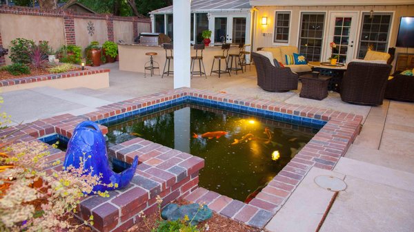 Ponds & Waterfalls - Imagine sitting next to a waterfall or fountain outside in the summer, with its cool water trickling down the stone. We can create sheer-descent waterfalls with clean sheets of water cascading over beautiful stone backgrounds, bubbly pots, nature-inspired installments that look like mountain streams, and anything in between. Ponds & Waterfalls - Imagine sitting next to a waterfall or fountain outside in the summer, with its cool water trickling down the stone. We can create sheer-descent waterfalls with clean sheets of water cascading over beautiful stone backgrounds, bubbly pots, nature-inspired installments that look like mountain streams, and anything in between.