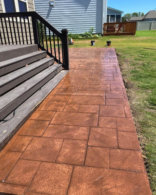 Masterpiece with RCC Concrete! 🌟 - We just completed another stunning project: a reddish stamped concrete porch that perfectly complements the outdoor ambiance of a residential home. Imagine sipping your morning coffee or hosting evening get-togethers on this beautiful, durable surface. Masterpiece with RCC Concrete! 🌟 - We just completed another stunning project: a reddish stamped concrete porch that perfectly complements the outdoor ambiance of a residential home. Imagine sipping your morning coffee or hosting evening get-togethers on this beautiful, durable surface.