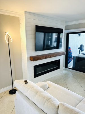 Custom Electric Fireplace - This custom electric fireplace comes 9” - 12” inches off the wall.  Is usually 8 ft high and 80” inches wide. 

I recommend a fireplace to match your TV, not the other way around. Both about the same actual width is a good aesthetic. 

Most of our projects take between three and four days to complete. We cleanup after ourselves and return your house cleaner than when we started!

In all of our quotes we include the cost of labor and all materials needed to complete the job, there will be no surprises!

For a free quote just send us a picture and measurements of your wall along with the design that you would like.