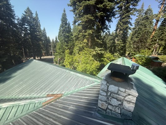Metal roof project Lake Tahoe - The metal roofing was thoroughly power washed and prepared to remove dirt, rust, and buildup. After proper surface preparation, a high-quality primer was applied to ensure strong adhesion. The roof was then finished with two coats of premium paint, providing long-lasting protection against the elements and a clean, refreshed appearance.