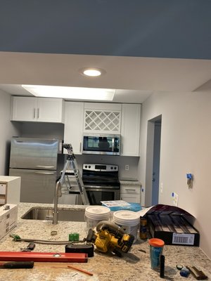 Condo backsplash - Customer requested backsplash wrap around behind refrigerator. Also request the under desk be done as well to help visually and act as a kick plate. Condo backsplash - Customer requested backsplash wrap around behind refrigerator. Also request the under desk be done as well to help visually and act as a kick plate.